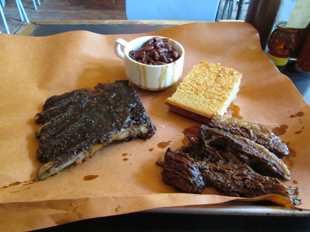 (left to right): pork ribs and brisket with baked beans and cornbread