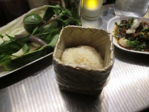sticky rice with accompanying herbs & veggies (left) and laap meuang (right)