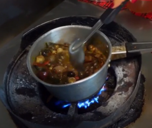 hep hot soup simmering on the stove (screenshot from Farang)