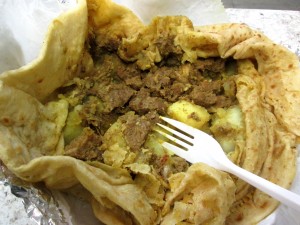 the goat roti from Caribbean Palace (opened to reveal curried goat & potatoes inside)