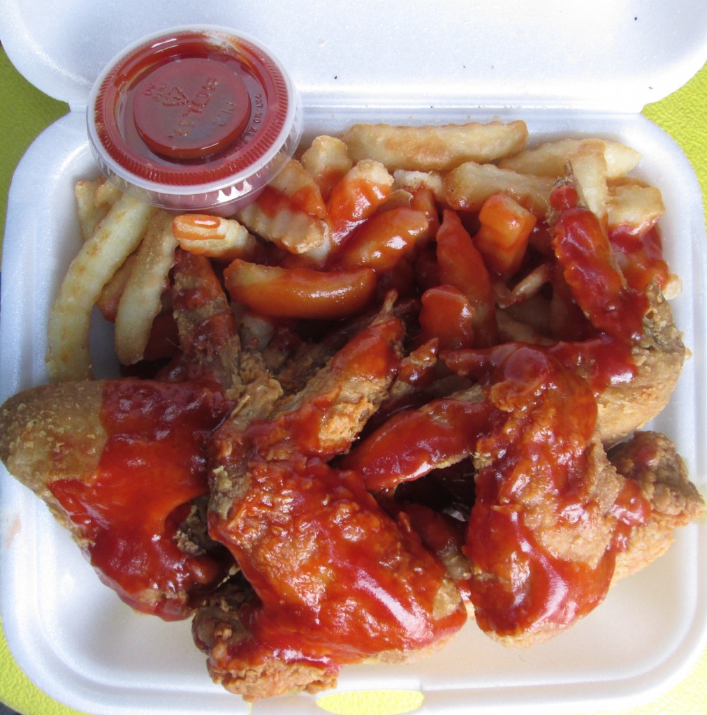 fried chicken wings and French fries (slathered with mumbo sauce) at Danny's